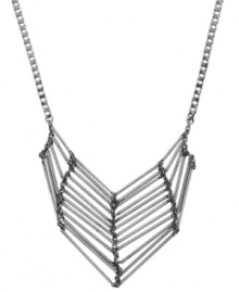 Unique and unexpected. A tapered tube motif lends a chic, contemporary look to BCBGeneration's stylish statement necklace. Crafted in oxidized silver tone mixed metal. Approximate length: 17 inches. Approximate drop: 2-1/4 inches.