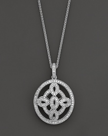 A dramatic oval medallion pendant crafted from white gold and diamonds, dangling from a 16 wheat chain. Domed to offer dimension.