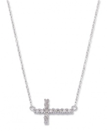 Symbolic sparkle with a taste of modernity. This pretty sideways cross pendant features round-cut diamonds (1/8 ct. t.w.) and a 14k white gold setting and chain. Approximate length: 17 inches. Approximate drop: 1/2 inch. Symbolic sparkle with a taste of modernity. This pretty sideways cross pendant features round-cut diamonds (1/8 ct. t.w.) and a 14k white gold setting and chain. Approximate length: 17 inches. Approximate drop: 1/2 inch.