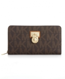 With a luxe 18K gold plaque and signature lock, it's easy to see why this discrete design from MICHAEL Michael Kors is the ultimate accessory. Eye-catching logo pattern graces the exterior, while plenty of internal compartments for cards, cash and ID keep your essentials organized. With a luxe 18K gold plaque and signature lock, it's easy to see why this discrete design from MICHAEL Michael Kors is the ultimate accessory. Eye-catching logo pattern graces the exterior, while plenty of internal compartments for cards, cash and ID keep your essentials organized.