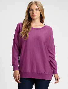 Made from merino wool and featuring classic ribbed trim, this sweater is a must-wear this season. Pair this relaxed-fit top with slim pants. Round neckLong sleevesRibbed trimPull-on styleAbout 28 from shoulder to hemMerino woolDry cleanImported of Italian fabric