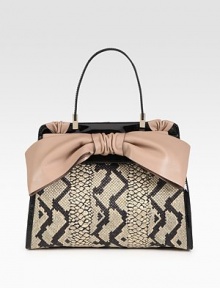 Chic python-printed straw meets supple leather in this sleek flap silhouette, finished with a demure leather bow.Top handle, 6½ dropFlap snap closureProtective metal feetOne inside zip pocketTwo inside open pocketsCotton lining14½W X 11H X 3½DMade in Italy Chic python-printed straw meets supple leather in this sleek flap silhouette, finished with a demure leather bow.Top handle, 6½ dropFlap snap closureProtective metal feetOne inside zip pocketTwo inside open pocketsCotton lining14½W X 11H X 3½DMade in Italy