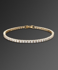 Sparkle never looked so sweet. CRISLU's head-turning tennis bracelet features a chic row of round-cut cubic zirconias (5-1/5 ct. t.w.) set in gold over sterling silver. Approximate length: 7 inches.