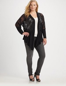 Floral lace style trimmed with satin ribbon and a gathered solid hem. Open design Long dolman sleeves Draped front About 32 from shoulder to hem Body: viscose Lace: nylon Hand wash Imported 