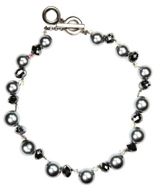 Perfectly polished. Add a dressy accent to your workday wardrobe with AK Anne Klein's elegant collar necklace. Embellished with imitation gray pearls and sparkling glass beads, it's crafted in hematite tone mixed metal. Includes a toggle closure. Approximate length: 17 inches.