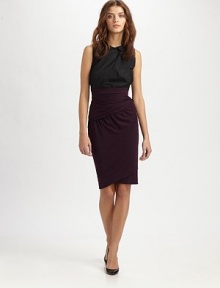 Asymmetrically draped knit skirt hits at the high waist, concluding with a contrasting, attached top and back button closures. CrewneckPeter Pan collarSleevelessAsymmetrical front hemBack button closuresAbout 25 from natural waist73% modal/18% wool/9% elastaneDry cleanImportedModel shown is 5'10 (177cm) wearing US size 4.