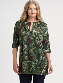 A striking print adorns this split-neck tunic. Pair this top with skinnies or slim-fitting pants. Split neckElbow-length sleevesAllover printAbout 31 from shoulder to hemVenezia/spandexDry cleanMade in USA