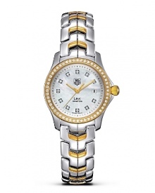 With its unique design, the TAG Heuer Link series has represented a perfect balance of sport and prestige since 1999. Its architecture reflects the power and beauty of steel through the play of contrasts and its refined lines. White mother-of-pearl dial with 11 diamonds and a polished 52 diamond accented 18 Kt. gold bezel. Features a date window. With its unique design, the TAG Heuer Link series has represented a perfect balance of sport and prestige since 1999. Its architecture reflects the power and beauty of steel through the play of contrasts and its refined lines. White mother-of-pearl dial with 11 diamonds and a polished 52 diamond accented 18 Kt. gold bezel. Features a date window.