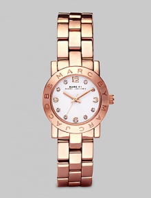 A classic style with a touch of sparkle and an iconic logo bezel. Quartz movementWater resistant to 3 ATMRound rose goldtone ion-plated stainless steel case, 26mm (1) Logo bezelWhite dialCrystal and numeric hour markersSecond hand Rose goldtone ion-plated stainless steel link braceletImported A classic style with a touch of sparkle and an iconic logo bezel. Quartz movementWater resistant to 3 ATMRound rose goldtone ion-plated stainless steel case, 26mm (1) Logo bezelWhite dialCrystal and numeric hour markersSecond hand Rose goldtone ion-plated stainless steel link braceletImported