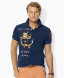 Faded and abraded for a timeworn quality, a trim-fitting cotton mesh polo is accented with Asian-inspired embroidery for handsome international style. Faded and abraded for a timeworn quality, a trim-fitting cotton mesh polo is accented with Asian-inspired embroidery for handsome international style.