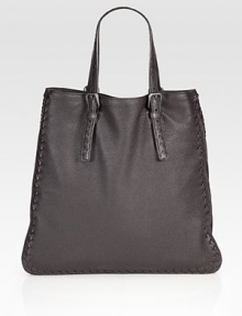 Luxurious leather design with an artisan braided shoulder strap and trim has super-soft suede lining.Double top handles, 7 drop One inside zip pocket One inside open pocket Suede lining 15W X 16H X 7D Made in Italy Luxurious leather design with an artisan braided shoulder strap and trim has super-soft suede lining.Double top handles, 7 drop One inside zip pocket One inside open pocket Suede lining 15W X 16H X 7D Made in Italy