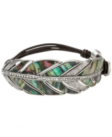 Get in touch with your organic side with Fossil's free-spirited style. A chocolate leather wrap bracelet features a beautifully-crafted feather decorated with an abalone shell inlay and crystal pave accents. Set in silver tone mixed metal. Approximate diameter: 2-1/2 inches.