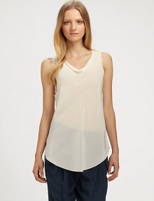 A cool and casual tank that can be dressed up or down.Draped neckSleevelessUnfinished hemAbout 30 from shoulder to hemSilkDry cleanImported A cool and casual tank that can be dressed up or down.Draped neckSleevelessUnfinished hemAbout 30 from shoulder to hemSilkDry cleanImported