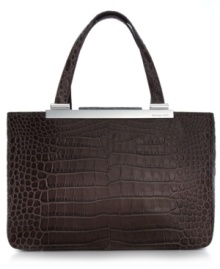 Accentuate your allure for the exotic with this MICHAEL Michael Kors silhouette in croc- or lizard-embossed leather. Gleaming custom hardware complements the classic carryall design that features an ultra-spacious interior. Carry it day or night for added edge to any outfit. Accentuate your allure for the exotic with this MICHAEL Michael Kors silhouette in croc- or lizard-embossed leather. Gleaming custom hardware complements the classic carryall design that features an ultra-spacious interior. Carry it day or night for added edge to any outfit.