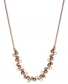 Simply stunning. This frontal strand necklace from Givenchy is crafted from brown gold-tone mixed metal with glass and cubic zirconia accents for a bold fashion statement. Approximate length: 16 inches + 2-inch extender.