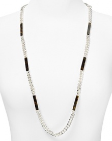 Glamor defined: A single strand of of silver-plated links mingle with tortoise shell for classically styled confidence. Slip on this ever-chic style from Lauren Ralph Lauren. Glamor defined: A single strand of of silver-plated links mingle with tortoise shell for classically styled confidence. Slip on this ever-chic style from Lauren Ralph Lauren.