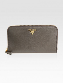 Timeless style in calfskin leather with a zip around closure.Zipper closure Gold-plated hardware Metal lettering logo Center coin compartment Zipper and bill compartment Eight credit card slots Calfskin leather lining 7½W X 4H X ¾D Made in Italy Timeless style in calfskin leather with a zip around closure.Zipper closure Gold-plated hardware Metal lettering logo Center coin compartment Zipper and bill compartment Eight credit card slots Calfskin leather lining 7½W X 4H X ¾D Made in Italy
