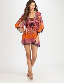 A silk coverup featuring a pretty paisley print and a flattering fit. V-neckSelf-tie detail at Empire waistThree-quarter sleevesSilkDry cleanImported A silk coverup featuring a pretty paisley print and a flattering fit. V-neckSelf-tie detail at Empire waistThree-quarter sleevesSilkDry cleanImported