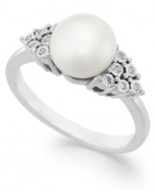 Polished to a T. This simple, yet stunning, ring highlights a cultured freshwater pearls (8 mm) and pretty crown-shaped side accents in diamond. Approximate diameter: 1/2 inch. Polished to a T. This simple, yet stunning, ring highlights a cultured freshwater pearls (8 mm) and pretty crown-shaped side accents in diamond. Approximate diameter: 1/2 inch.