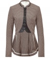 For a modern riff on classic equestrian chic (one of the seasons hottest trends), try McQ Alexander McQueens elegant cotton and wool blend riding jacket - Slim, tailored silhouette nips at waist - Traditional brown houndstooth motif - Leather accents at elbows, neckline and button placket - Small stand up collar, decorative buttons and pleat detail at back - Pair with slim trousers, skinny denim and tall boots or ankle booties