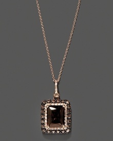 Diamonds and brown diamonds frame an emerald cut smoky quartz, set in 14K rose gold.