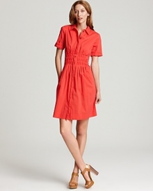 This buttoned-up Elie Tahari dress is cleverly offset by its vibrant color, creating a look where sophistication meets fun.