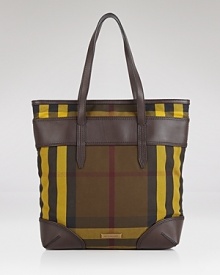 Burberry's signature check is refreshed for this season in a day-right shape and contrasting tones. This tote flaunts a modern ease that's ideal for the busiest of days. Burberry's signature check is refreshed for this season in a day-right shape and contrasting tones. This tote flaunts a modern ease that's ideal for the busiest of days.