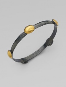 Beautifully textured stations in radiant 24k gold on a dark sterling silver bangle. Dark sterling silver24k goldDiameter, about 2½Slip-on styleImported 