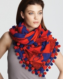 Make a statement with this cozy scarf featuring a colorful weave of red and blue abstract check and matching ball trim. Make a statement with this cozy scarf featuring a colorful weave of red and blue abstract check and matching ball trim.