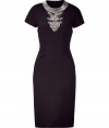 Luxe short sleeve cocktail dress in fine black wool - Sexy, feminine fit makes a bold statement - Hits below the knee - Ruching at sides - Intricate bead embellishment at chest and cut out detail create the illusion of a separate neck piece - Pair with platform pumps and cocktail rings