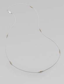 A graceful sterling silver chain, delicately spaced with clusters of tiny, faceted 14k gold beads.14k yellow gold and sterling silverLength, about 26Spring ring claspMade in USA A graceful sterling silver chain, delicately spaced with clusters of tiny, faceted 14k gold beads.14k yellow gold and sterling silverLength, about 26Spring ring claspMade in USA