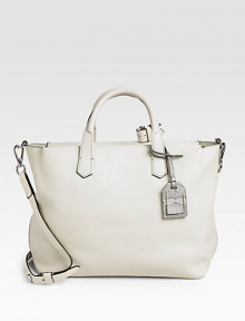 This ultra spacious leather carryall in a soft, muted palette works as a gym bag or workwear accessory.Double top handles, 4 drop Removable, adjustable crossbody strap, 19-22 drop Snakeskin luggage tag Top zip closure One inside zip pocket Two inside open pockets Cotton lining 14W X 10H X 6D Imported This ultra spacious leather carryall in a soft, muted palette works as a gym bag or workwear accessory.Double top handles, 4 drop Removable, adjustable crossbody strap, 19-22 drop Snakeskin luggage tag Top zip closure One inside zip pocket Two inside open pockets Cotton lining 14W X 10H X 6D Imported