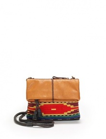 THE LOOKRemovable, adjustable braided crossbody strapTop zip closureFront multicolor tribal-inspired embroidery insetOne outside zip pocketOne inside zip pocketOne inside open pocketInside logo detailTHE MEASUREMENTCrossbody strap, 18-24 drop9½W X 11½H X ¼DTHE MATERIALLeatherLogo printed liningORIGINImported THE LOOKRemovable, adjustable braided crossbody strapTop zip closureFront multicolor tribal-inspired embroidery insetOne outside zip pocketOne inside zip pocketOne inside open pocketInside logo detailTHE MEASUREMENTCrossbody strap, 18-24 drop9½W X 11½H X ¼DTHE MATERIALLeatherLogo printed liningORIGINImported