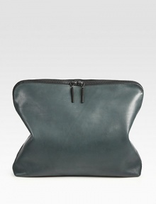 A contemporary design of supple leather with a polished finish. Top handle, 1 dropZip-top closureOne inside zip pocket15W X 6H X 3½DImported A contemporary design of supple leather with a polished finish. Top handle, 1 dropZip-top closureOne inside zip pocket15W X 6H X 3½DImported