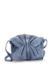 THE LOOKCrossbody strapMagnetic tab closure under the cinched flapDrawstring topPython-covered studs at sidesOne inside zip pocketOne inside leather open pocketTwo inside leather pen holdersInside key hookInside logo detailTHE MEASUREMENTCrossbody strap, 27 drop10W X 8H X 5DTHE MATERIALPythonLeather and printed fabric liningORIGINMade in USA THE LOOKCrossbody strapMagnetic tab closure under the cinched flapDrawstring topPython-covered studs at sidesOne inside zip pocketOne inside leather open pocketTwo inside leather pen holdersInside key hookInside logo detailTHE MEASUREMENTCrossbody strap, 27 drop10W X 8H X 5DTHE MATERIALPythonLeather and printed fabric liningORIGINMade in USA