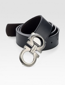 Black on one side and hickory on the other, this reversible belt crafted in smooth Italian leather with double gancini buckle, will be a stylish, versatile addition to your existing wardrobe.LeatherAbout 1½ wideMade in Italy