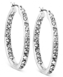 Glass crystals are always in-and out-in this pair of medium hoop earrings from Anne Klein. Crafted from silver-tone mixed metal. Approximate diameter: 1-3/4 inches. Glass crystals are always in-and out-in this pair of medium hoop earrings from Anne Klein. Crafted from silver-tone mixed metal. Approximate diameter: 1-3/4 inches.