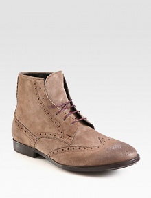 A classic brogue boot is constructed in a rich suede and slightly burnished and distressed for a well-worn look.Suede upperLeather liningRubber soleImported