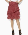 Crafted in crinkled silk georgette, a tiered ruffle skirt adds a flirty element to any wardrobe.