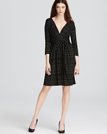 Carry off the ladylike statement without saccharine girlishness in this DKNY dress. A delicate dot print enlivens a fit-and-flare silhouette for a classic feminine statement.