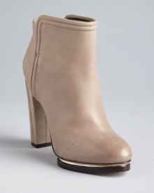 Bold, metal-accented, sculpted platforms give these Rachel Roy booties edge. Bold, metal-accented, sculpted platforms give these Rachel Roy booties edge.