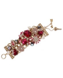 Embrace your versatile side with Betsey Johnson's statement-making toggle bracelet. Crafted in antique gold tone mixed metal, this wide multi-link bracelet features fuchsia-colored crystal gems, glass pearls, gold tone heart lock with pink-colored crystal accents and hematite crystals with crown base. Approximate length: 7-1/2 inches. Embrace your versatile side with Betsey Johnson's statement-making toggle bracelet. Crafted in antique gold tone mixed metal, this wide multi-link bracelet features fuchsia-colored crystal gems, glass pearls, gold tone heart lock with pink-colored crystal accents and hematite crystals with crown base. Approximate length: 7-1/2 inches.
