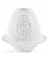 A traditional nutcracker design lights up in this votive candle holder, handcrafted of white porcelain. From Lladro.