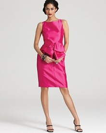 An oversize bow at the waist lends feminine charm to this richly hued and impeccably tailored Carmen Marc Valvo dress. An oversize bow at the waist lends feminine charm to this richly hued and impeccably tailored Carmen Marc Valvo dress.