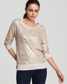 Shimmering sequins create subtle stripes on this DKNY sweater, rendered in luxe silk and cashmere for lightweight warmth.