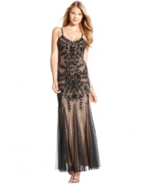 Dazzling jewel-like beading and sequins take center stage on the front of this Adrianna Papell gown, while slender spaghetti straps highlight the elegantly dramatic open-back style. Dazzling jewel-like beading and sequins take center stage on the front of this Adrianna Papell gown, while slender spaghetti straps highlight the elegantly dramatic open-back style.