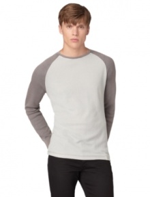 Simple yet stylish, this Calvin Klein Jeans baseball tee is a homerun.