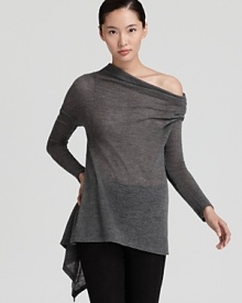 Rendered in lightweight wool, this sheer Donna Karan New York turtleneck tunic flaunts a flared body and asymmetric hem for a modern take on a classic style. Effortless with leggings for the weekend or a pencil skirt for workdays, it's your new versatile go-to. Rendered in lightweight wool, this sheer Donna Karan New York turtleneck tunic flaunts a flared body and asymmetric hem for a modern take on a classic style. Effortless with leggings for the weekend or a pencil skirt for workdays, it's your new versatile go-to.
