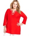 Add polish to your casual wear with J Jones New York's three-quarter-sleeve plus size tunic top, accented by a beaded neckline.