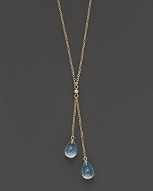 Twin blue topaz briolettes sparkle from this 14K yellow gold lariat necklace.